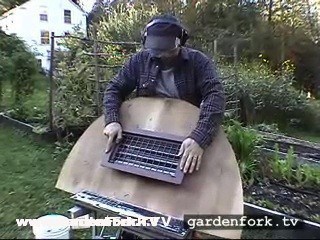 cut a plywood end that matches the arc of your hoop house cold frame. cut out a hole for the thermatic vent in the plywood