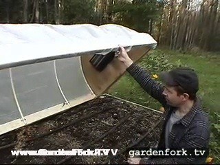 The cold frame hoop house fits just inside the raised bed. nice. 