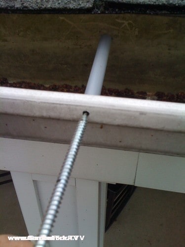 Be sure to position the spacer in the gutter before screwing in the screws.