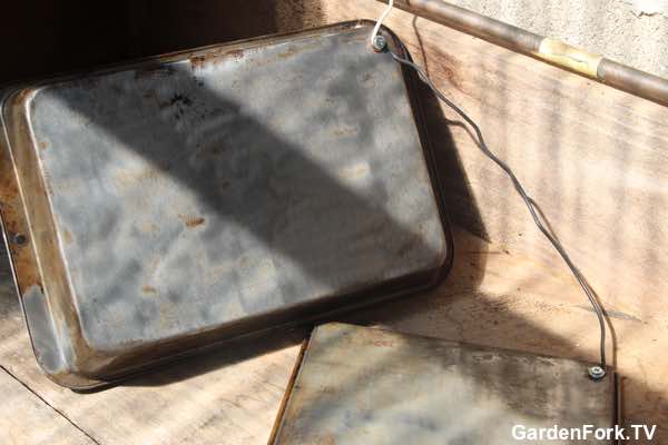 Cleaning cast iron with a battery charger