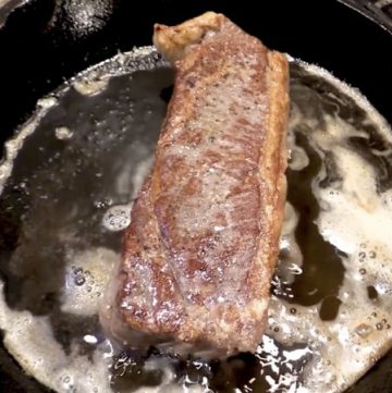 steak in fry pan