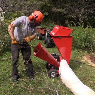 man with wood chipper