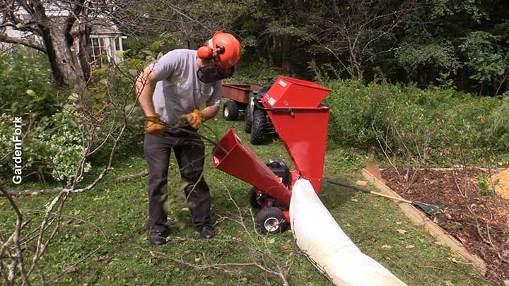 man with wood chipper