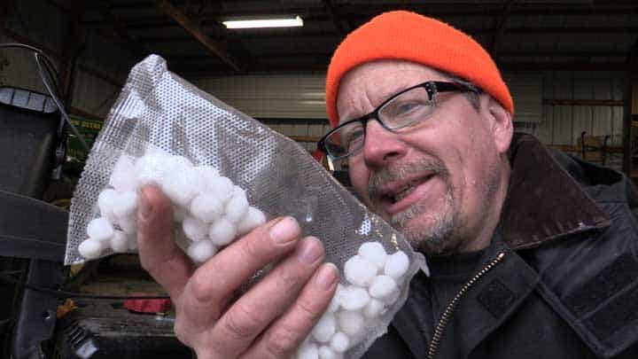 A man holding a mothballs