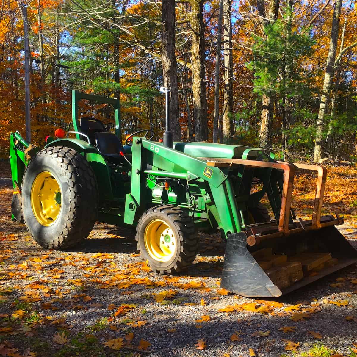 A tractor parked in a forest