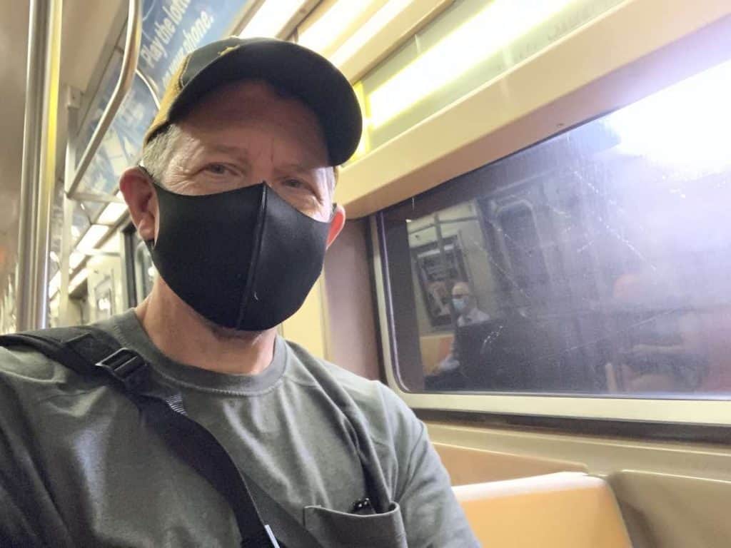 man on subway train